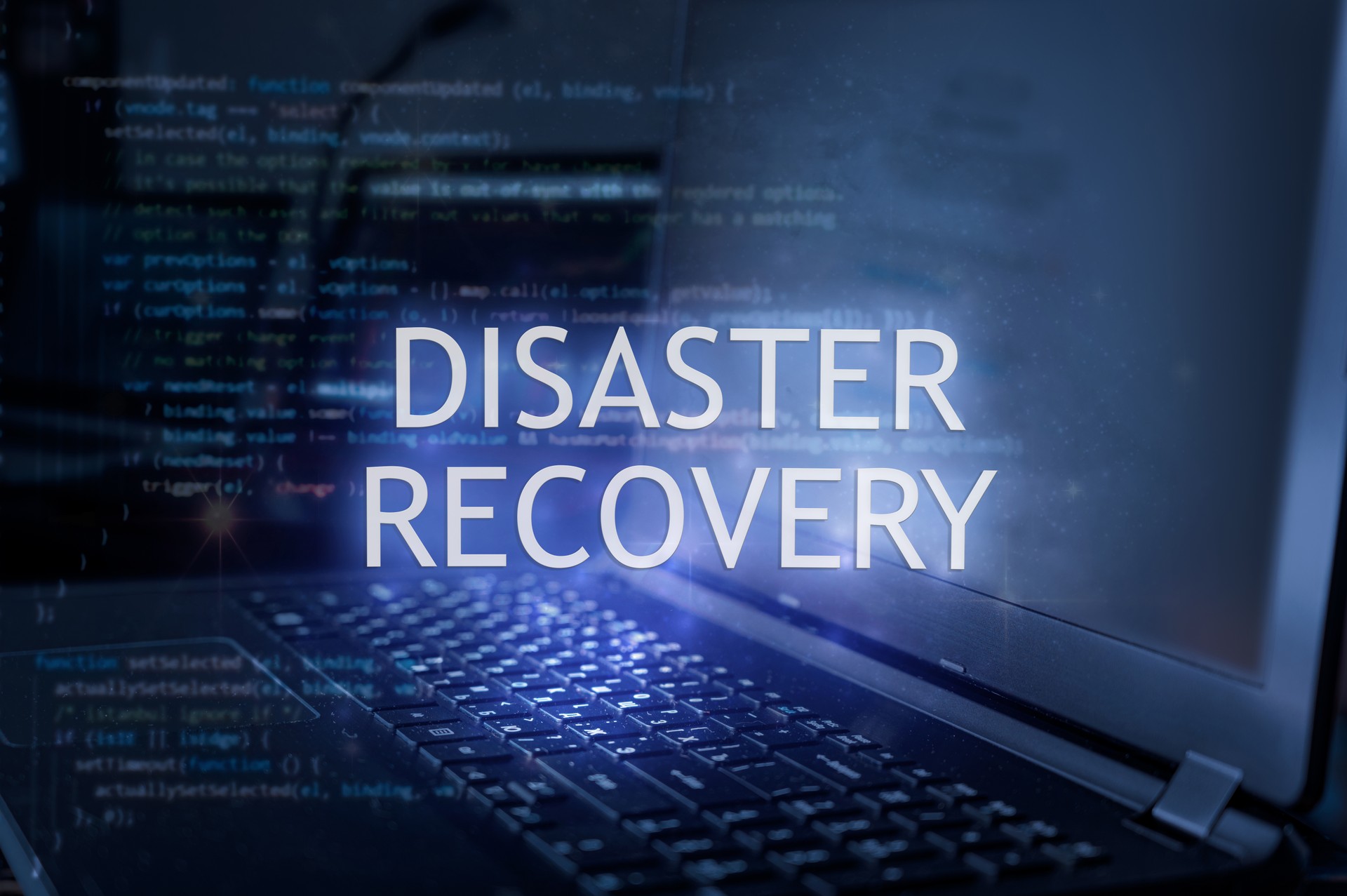 Disaster recovery inscription against laptop and code background.
